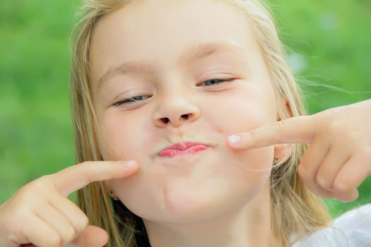 Portrait of girl with smile and makes faces