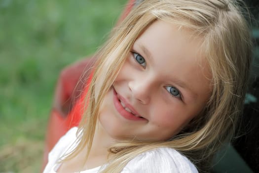 Portrait of smiling girl with blue eyes