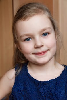 Portrait of beautiful caucasian blonde girl smiling indoor