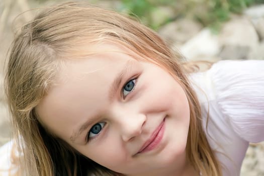 Portrait of cute girl with blond hair