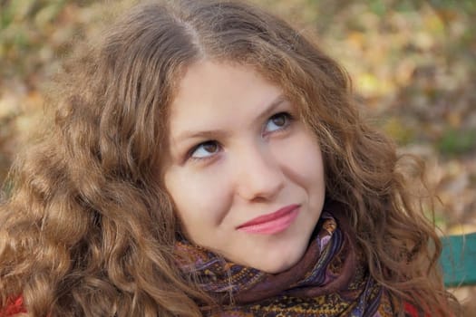 Portrait of thinking young woman with long hair