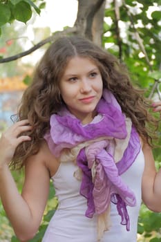 Portrait of woman with violet scarf in summer time