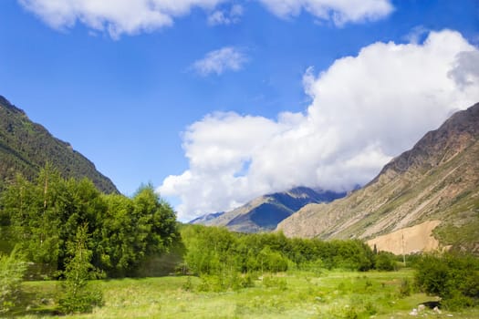 Summer landscape with Russian Caucasus green mountains