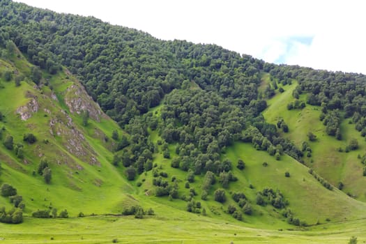 Summer landscape with Russian Caucasus green mountains