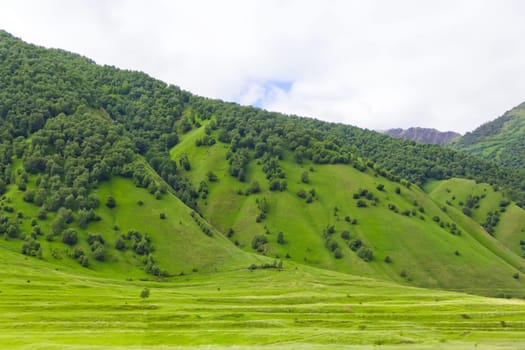 Summer landscape with Russian Caucasus green mountains