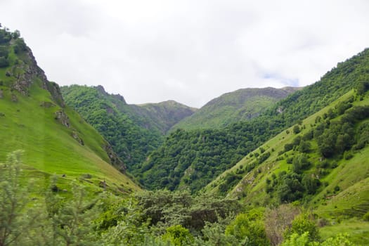 Summer landscape with Russian Caucasus green mountains