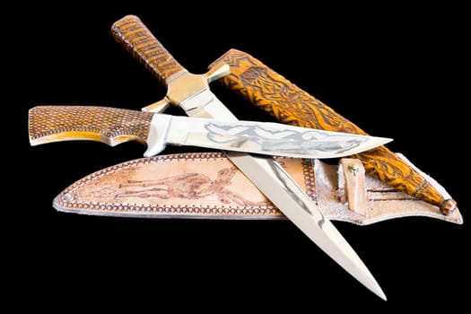 Photo of cold weapon on black background