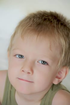 Portrait of cute boy with blue eyes