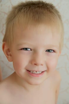 Portrait of cute boy with blue eyes