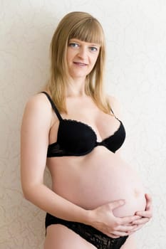 Image of pregnant woman in black underwear