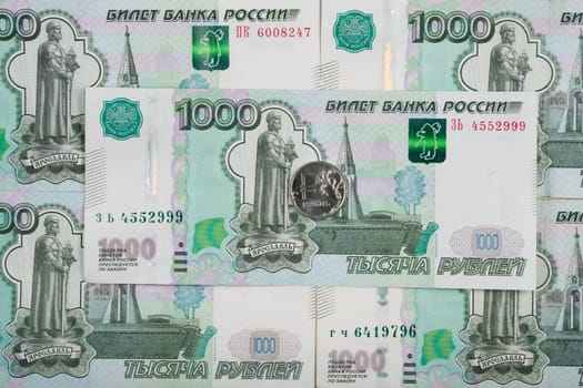 On thousandth of Russian rubles banknote is one ruble coin