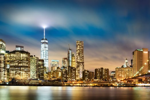 New York City - beautiful sunrise over manhattan with manhattan and brooklyn bridge USA