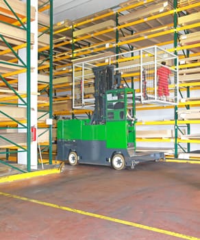 Side Loaded Forklift With Basket in Timber Warehouse