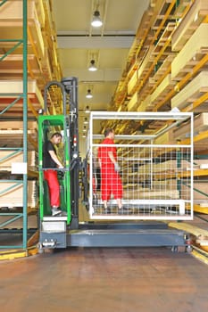 Side Loading Forklift With Basket in Timber Warehouse