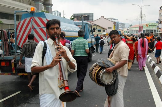 7 February 2009 - Georgetown, Penang: A pair of street musicians add revelry to the Thaipusam procession in Penang