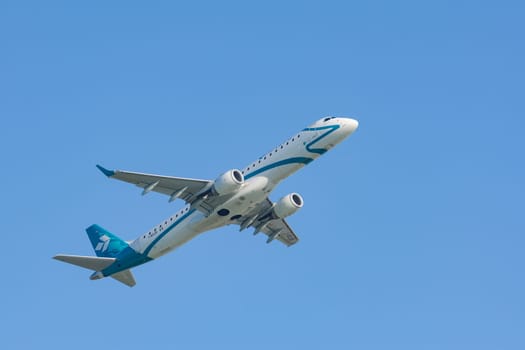 Munich, Germany - May 6, 2016: Jet plane Embraer E-Jet ERJ-195 of Air Dolomiti Italian airlines take off from Munich international passenger airport and gains altitude.