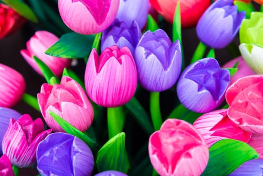 Wooden tulips souvenirs painted in vivid colours in Amsterdam, the Netherlands