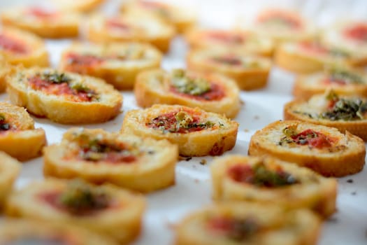 Fresh baked light and delicious bruschetta appetizers with tomato amd oregano. Selective focus