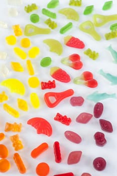 Various colorful fruit gums in gradient