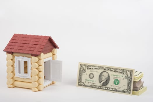 At toy house opened the door, the door is a pack of US dollars