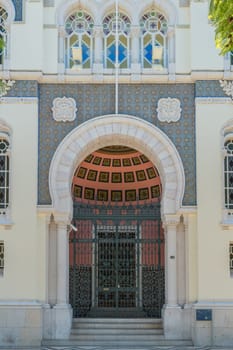 FARO, PORTUGAL - OCTOBER 01, 2016: Banco de Portugal Building in the city of Faro, Algarve, Portugal. Neo-Manueline Revivalist Architecture, with Islamized suggestions at the front door.