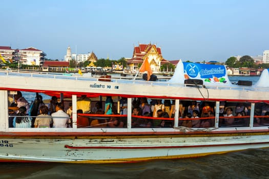 BANGKOK - JANUARY 4: people in the boat at the river Mae Nam Chao Phraya on January 4, 2010 in Bangkok, Thailand. Boat ferry is a regular public service on the river.