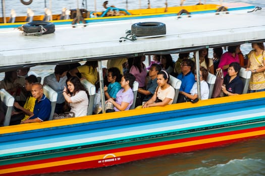BANGKOK - JANUARY 4: people in the boat at the river Mae Nam Chao Phraya on January 4, 2010 in Bangkok, Thailand. Boat ferry is a regular public service on the river.