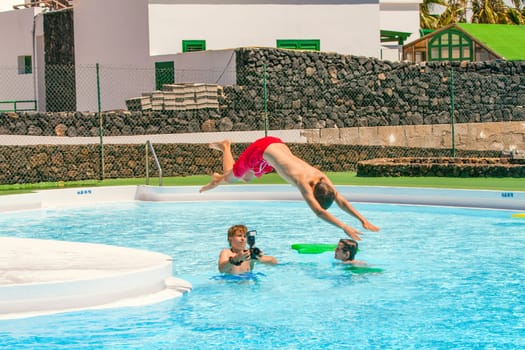 young photographer takes pictures at the pool
