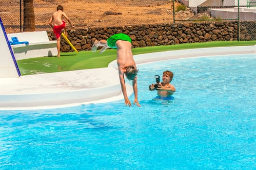 young photographer takes pictures at the pool