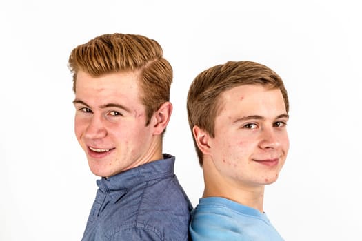 portrait of handsome brothers posing in studio