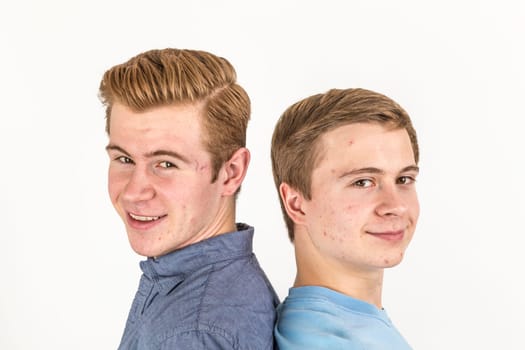 portrait of handsome brothers posing in studio