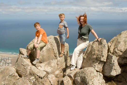 family with view from cliffs of Famara to the sea