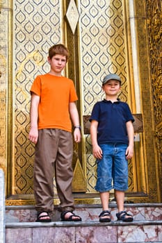 children are posing in the grand palace in Bangkok