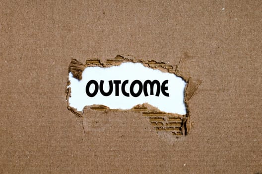 The word outcome appearing behind torn paper