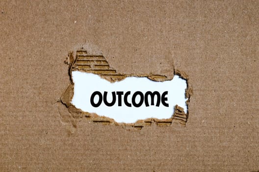 The word outcome appearing behind torn paper