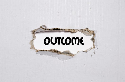 The word outcome appearing behind torn paper
