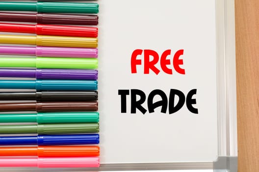 Felt-tip pen and whiteboard on a wooden background and text concept