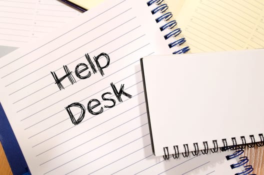 Help desk text concept write on notebook
