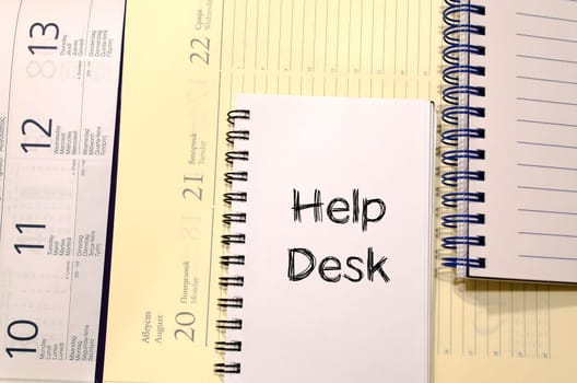 Help desk text concept write on notebook