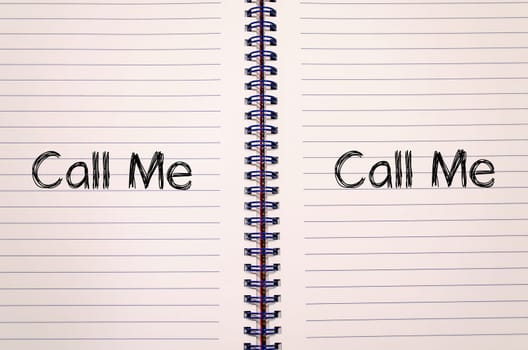 Call me text concept write on notebook