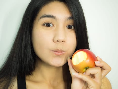 Asian woman smilling red apple on white background