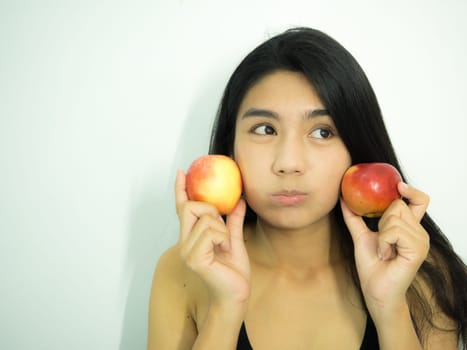 Asian woman smilling red apple on white background