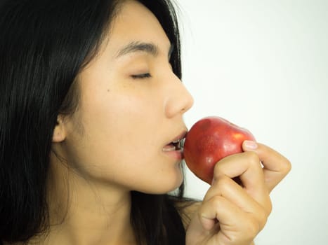 Asian woman smilling red apple on white background