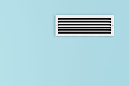 Air conditioning vent on the blue wall
