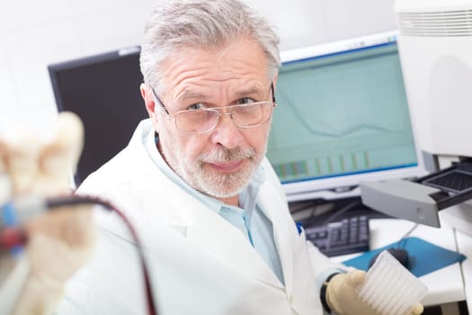 Life science researcher  performing a genotyping testing which enables personalized medicine. PM is a medical model that proposes the customization of healthcare.