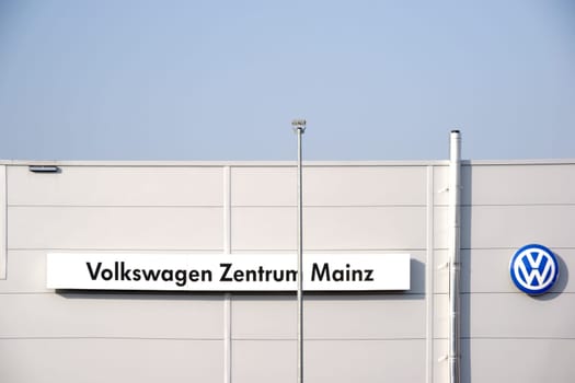 Mainz,Germany - February 14,2017: The façade and roof edge of the car salesman and the car repair workshop Volkswagen Center with logo on February 14,2017 in Mainz.