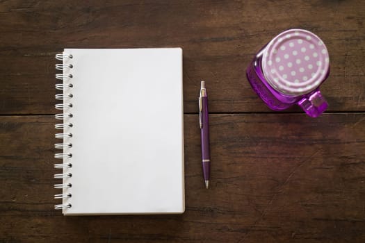 Notepaper, pen and drink on wooden table, stock photo