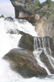 Waterfall with white,foaming spray