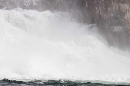Waterfall with white,foaming spray
