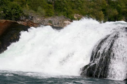 Waterfall with white,foaming spray